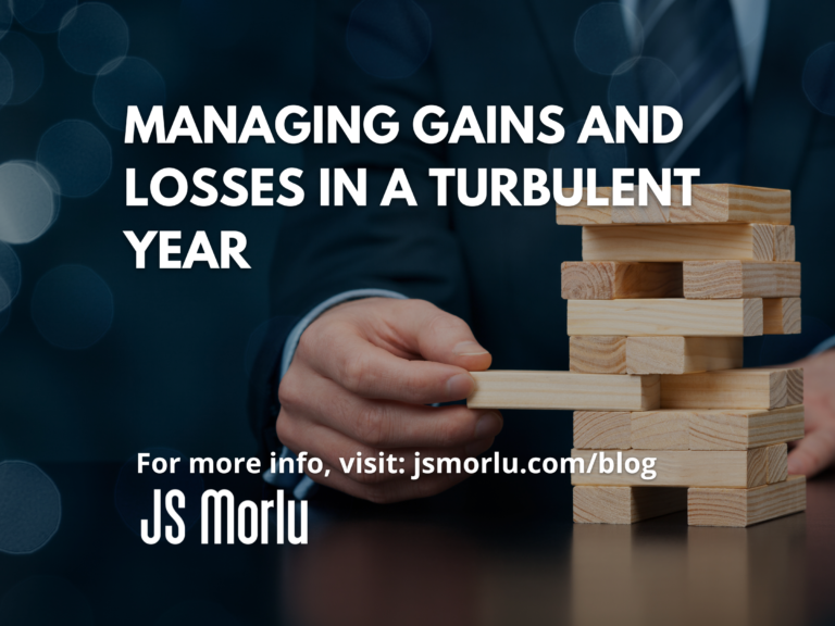 Smartly dressed businessman creatively engages with building blocks - Managing gains and losses.